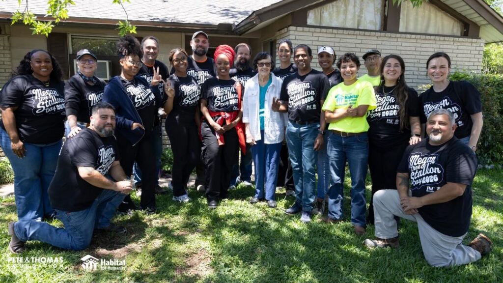 Group photo of home repair recipient Rosa and Habitat for Humanity staff and volunteers